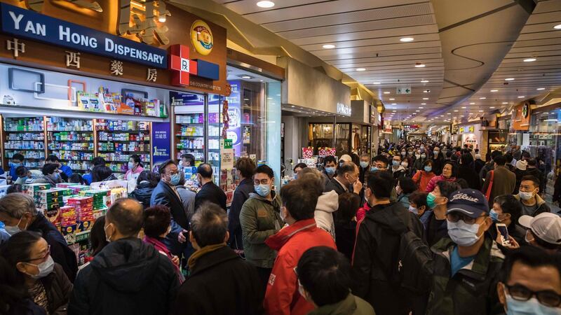 People wait in a queue and gather outside outside a pharmacy selling masks in Hong Kong on January 30th, 2020, as a preventative measure after a virus outbreak which began in the Chinese city of Wuhan. Photograph: Dale de la Rey/Getty Images