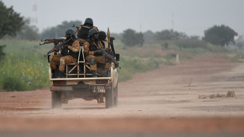Burkinabe gendarmes patrol near  in Ouagadougou in 2015. Burkina Faso security forces have launched a manhunt  after the abductions. File photograph: Sia Kambou/AFP via Getty Images