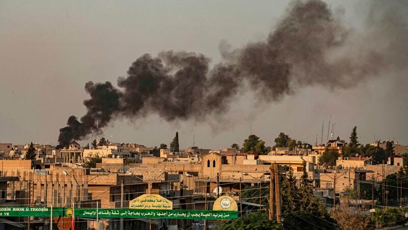 Smoke billows after Turkish bombardment of Syria’s northeastern town of Ras al-Ayn in the Hasakeh province, along the Turkish border, on Wednesday. Photograph: Delil Souleiman/AFP/Getty