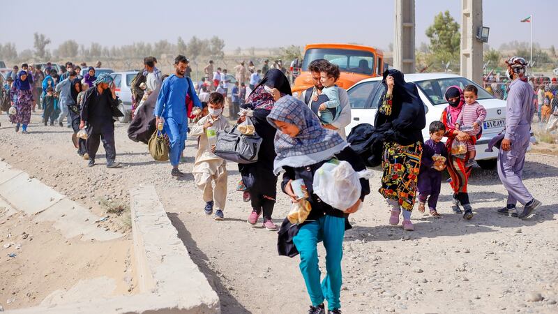 Afghan refugees gather in Iran-Afghanistan border in southeastern Iran. Photograph: Mohammad Javadzadeh / Iranian Red Crescent/ EPA