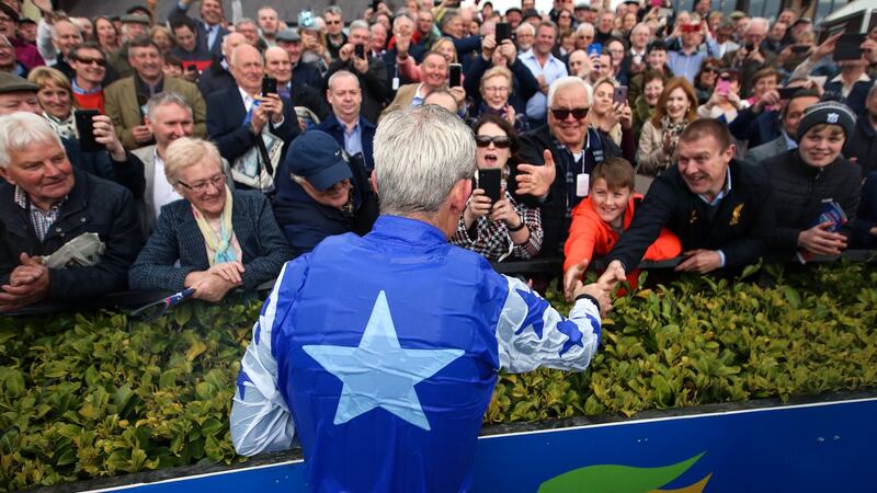Walsh shakes hands with racegoers from the other side of the winner’s enclosure. Photograph: Tommy Dickson/Inpho