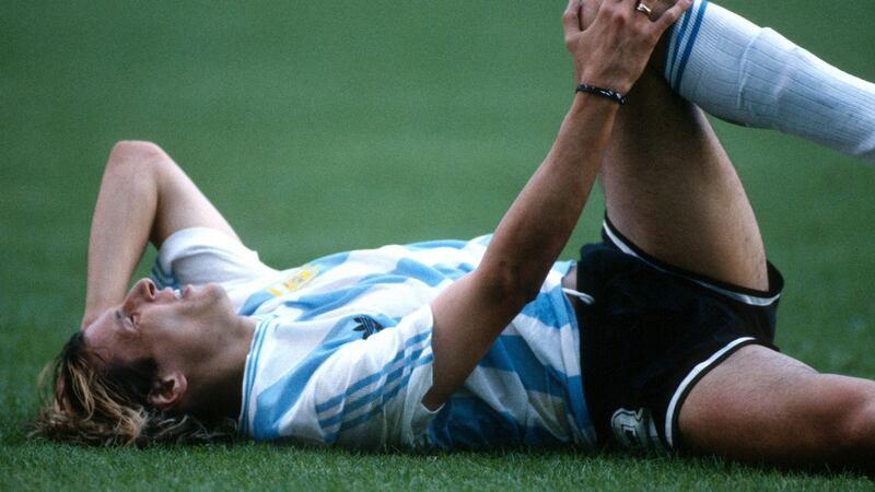 Claudio Caniggia of Argentina lies on the floor after tackle by Massing. Photograph: Mark Leech/Offside via Getty