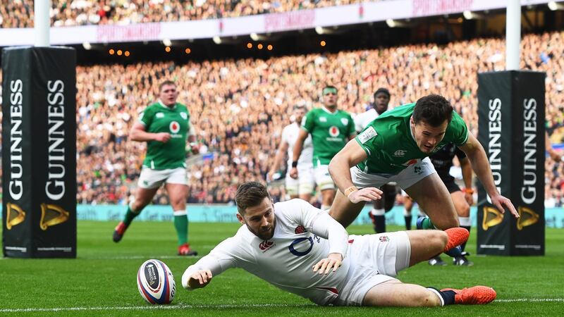 England’s Elliot Daly touches down ahead of Ireland’s Jacob Stockdale during the Six Nations game at  Twickenham. Photograph: Facundo Arrizabalaga/EPA