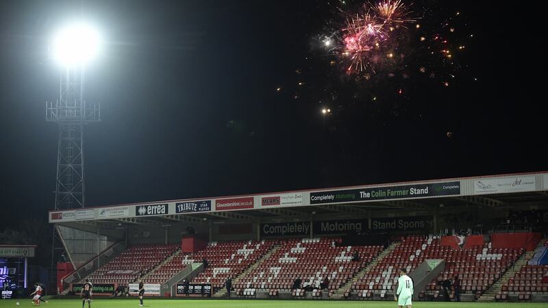 Fireworks are set off during Cheltenham’s clash with Manchester City. Photograph: Toby Melville /EPA