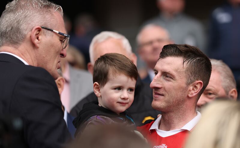 Cork’s Patrick Horgan and his son Jack talk to Jarlath Burns after the NHL final in Páirc Uí Chaoimh on Sunday. Photograph: James Crombie/Inpho