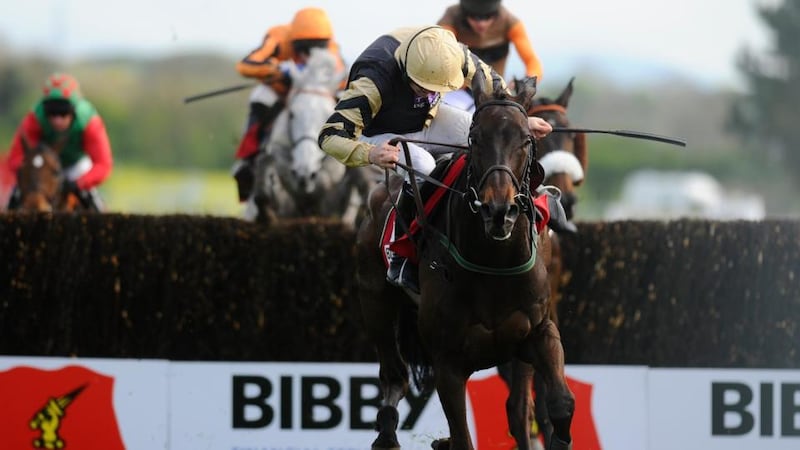 Ruby Walsh is almost unseated by Boston Bob after jumping the last but the partnership survived the scare to land the Bibby Financial Services Ireland Punchestown Gold Cup yesterday. Photograph: Alan Crowhurst/Getty Images