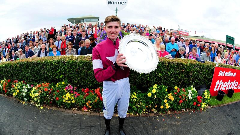 Winning jockey Donagh Meyler with the trophy. Photograph:  Healy Racing