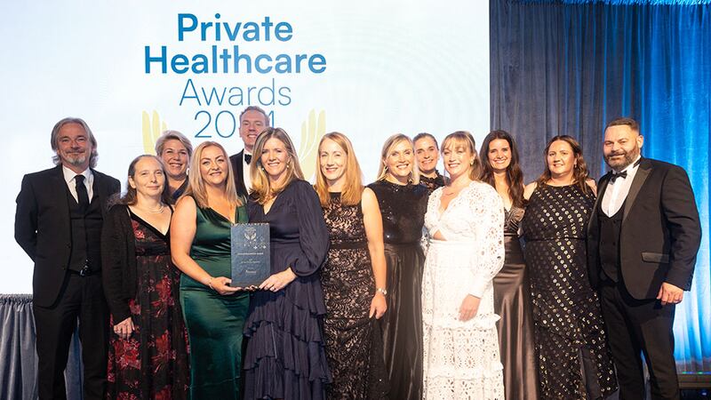 Lana Kane, managing director of Medforce, presents the overall excellence award to Mater Private Network Team