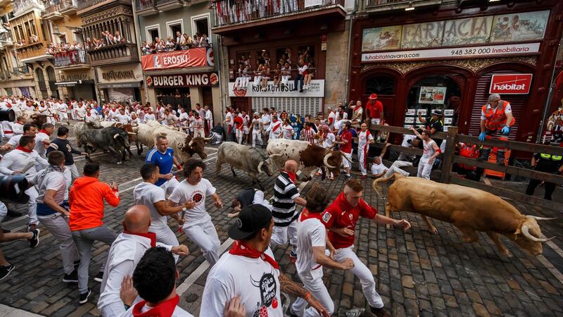 Runners flee the bulls during the San Fermin  festival. Photograph: AFP