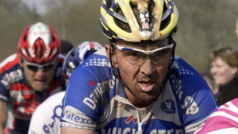 Belgium’s Johan Museeuw rides  in the 2004 Paris-Roubaix cycling race. Photograph: Damien Meyer/AFP/Getty Images