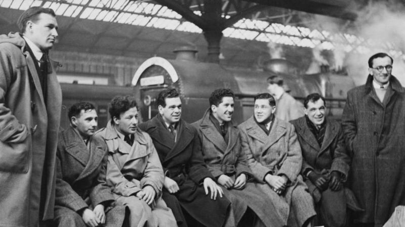 The Irish team, with Jack Kyle third from left, gather at Dublin Station for a Five Nations match against England in 1951. They won 3-0. (From left) James William McKay, William Henry Jordan Millar, Kyle, Richard Rodney Chambers, Noel Joseph Henderson, Desmond McKibbin, James Edward Nelson and John Hartley Smith.Photograph: Fox Photos/Hulton Archive/Getty Images