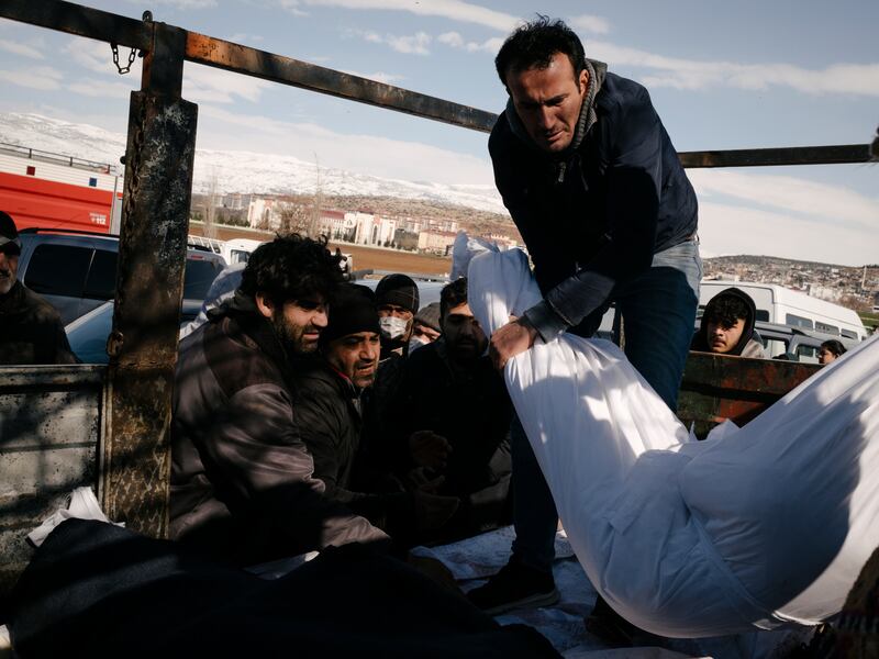 Civilians carry the body of a relative, to be buried in their village near Pazarcik, Turkey. Photograph: Emin Ozmen/New York Times