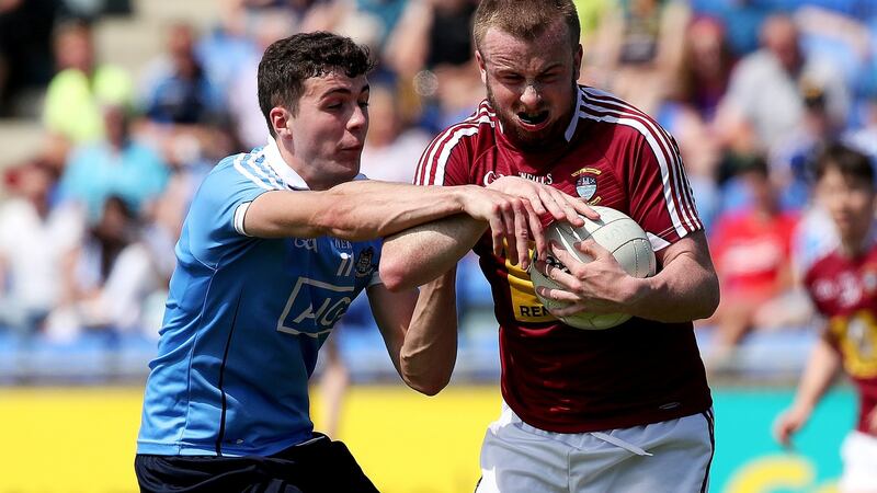 Dublin’s James Madden and Eoin Nally of Westmeath in action.  Madden is to become the 53rd Irish player to come through the AFL system. Photograph:  Bryan Keane/Inpho