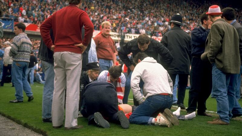 Supporters on the pitch after the FA Cup semi-final match between Liverpool and Nottingham Forest at Hillsborough in 1989. Photograph: David Cannon/Allsport
