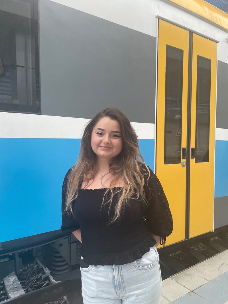 Adelina Roscu with the Iasi-Chisinau train behind her.