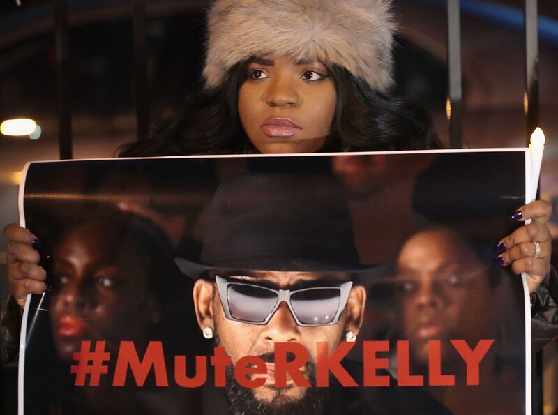 #MuteRKelly: a demonstrator at a protest near the singer’s studio in Chicago in 2019. Photograph: Scott Olson/Getty