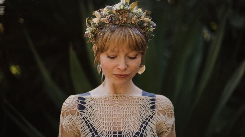 Alice Halliday wearing one of her crown headpieces