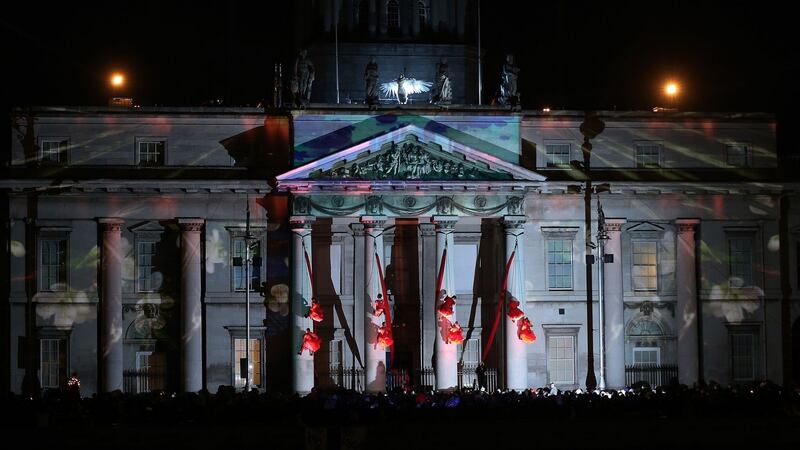 The Fidget Feet acrobatic group perform aerial contemporary dance against Dublin’s Custom House as part of the city’s New Year’s eve celebrations. Photograph: Niall Carson/PA