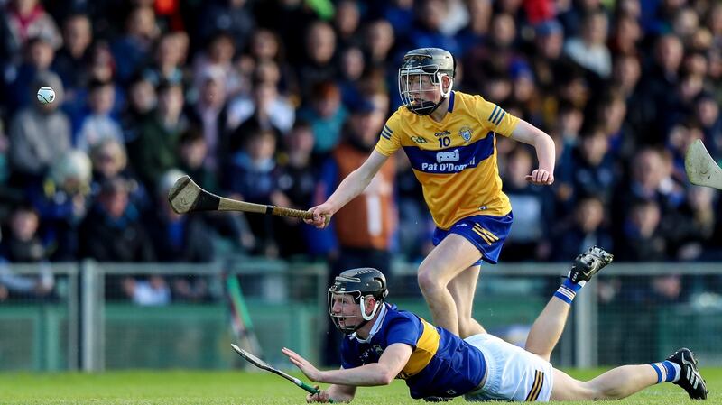 Tipperary’s Jack Quinlan in action against  Michael Collins of Clare during the  Electric Ireland Munster Minor Hurling Championship  final at the TUS Gaelic Grounds. Photograph: Evan Treacy/Inpho