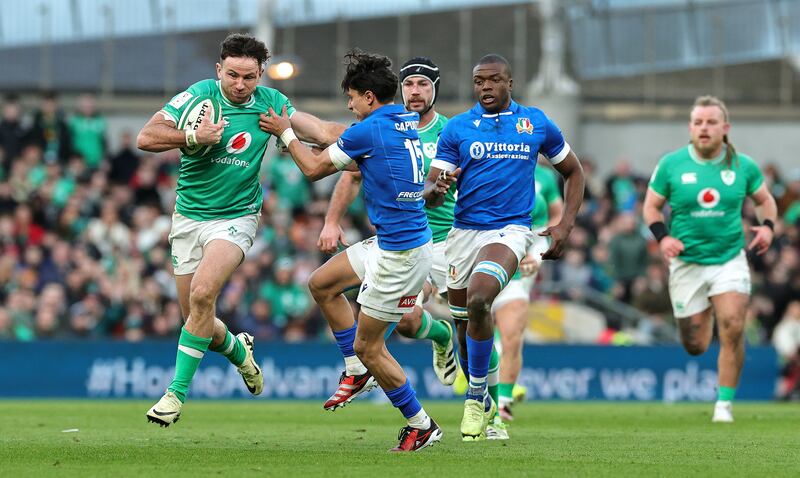 Ireland's Hugo Keenan is held by Ange Capuozzo during the Six Nations  match between Ireland and Italy at the Aviva Stadium on February 11th. Photograph: David Rogers/Getty Images