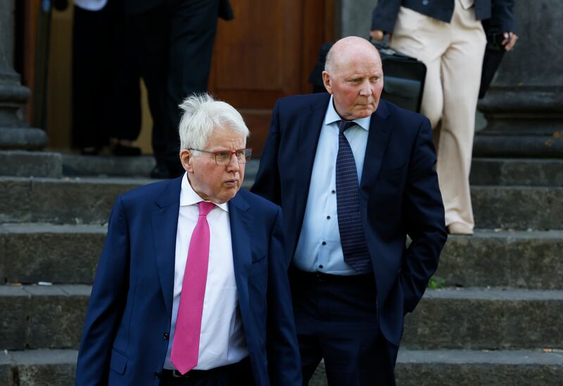 Solicitor Damien Tansey (front) and Sean Grogan, a cousin of the deceased, leaving the court in Tullamore. Photograph: Nick Bradshaw