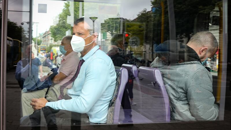 Mandatory masks on public transport: Luas passengers wearing masks. Photograph: Crispin Rodwell