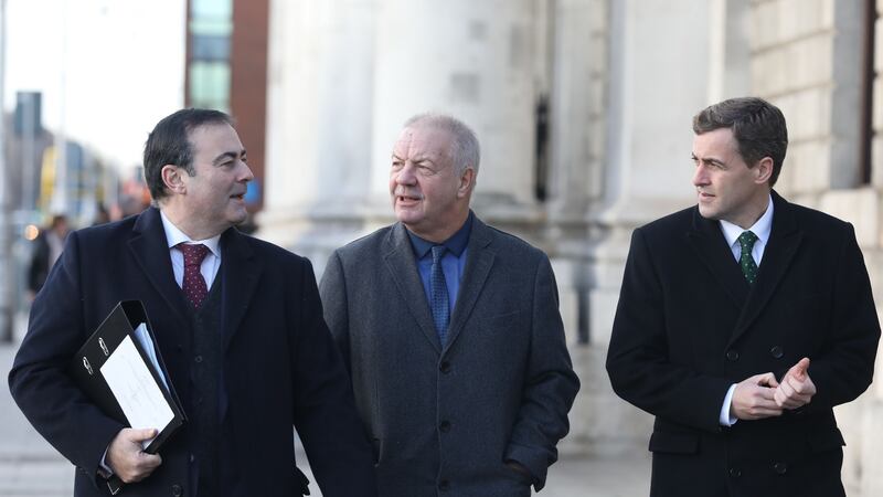 Solicitor Paul Farrell, Raymond McCord and Senator Mark Daly leaving the Four Courts on Monday. Mr McCord told the High Court there is “no clear policy” on a border poll in Ireland. Photograph: Collins Courts