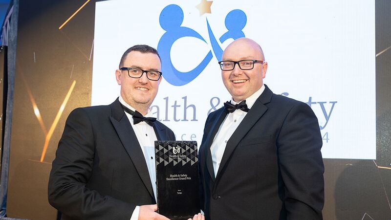 Stephan Doyle, awards judge, presents the health & safety excellence grand prix to Tom Crosbie, Tirlán