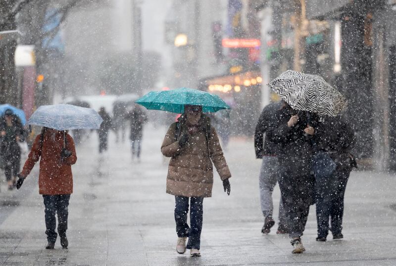 People walk through snow in Dublin this morning. Photograph: Sam Boal/Collins Photos