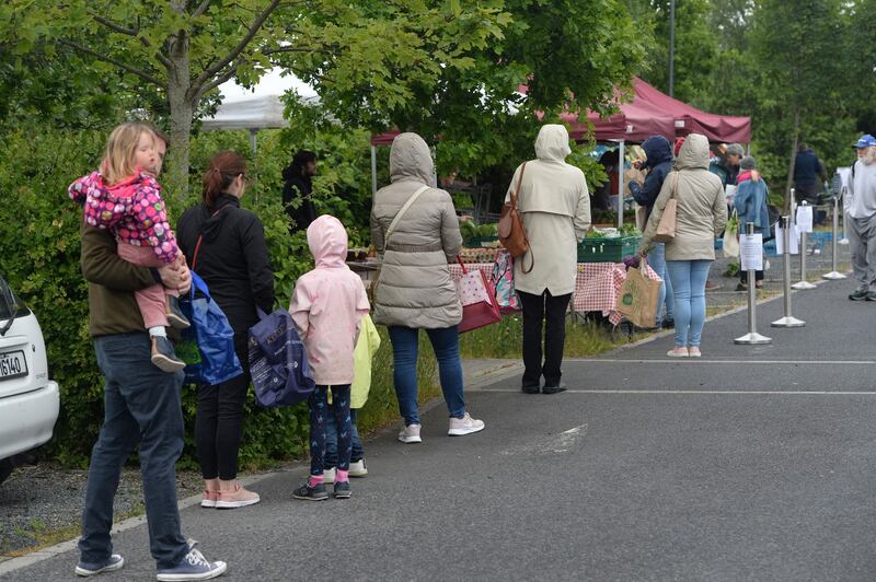 Queues were longer than usual at the newly reopened open-air market. Photograph: Dara Mac Dónaill/The Irish Times