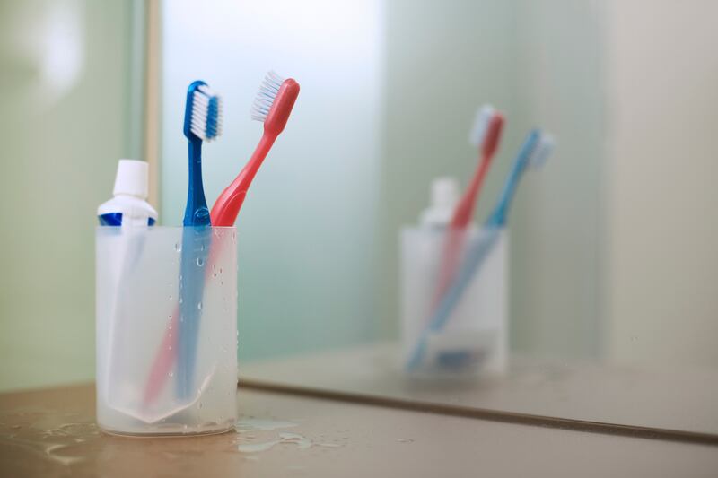 Flushing a toilet releases a plume of microscopic droplets, which can land on nearby toothbrushes. Photograph: Getty Images