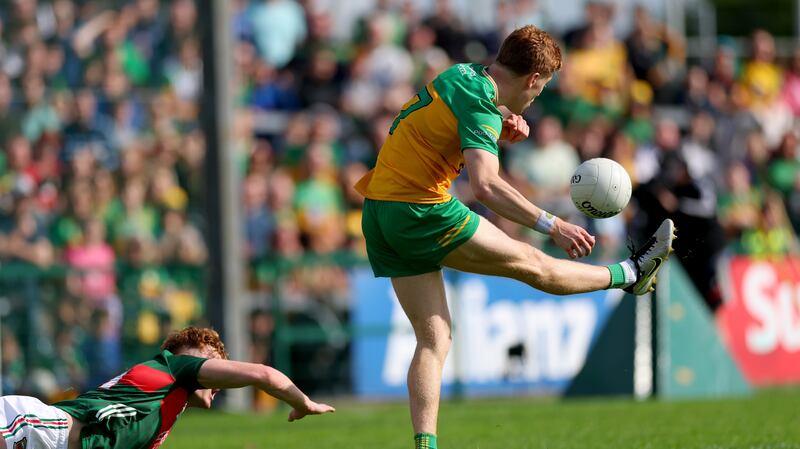 Donegal’s Ciarán Moore scores the winning point against Mayo at Dr Hyde Park. Photograph: James Crombie/Inpho