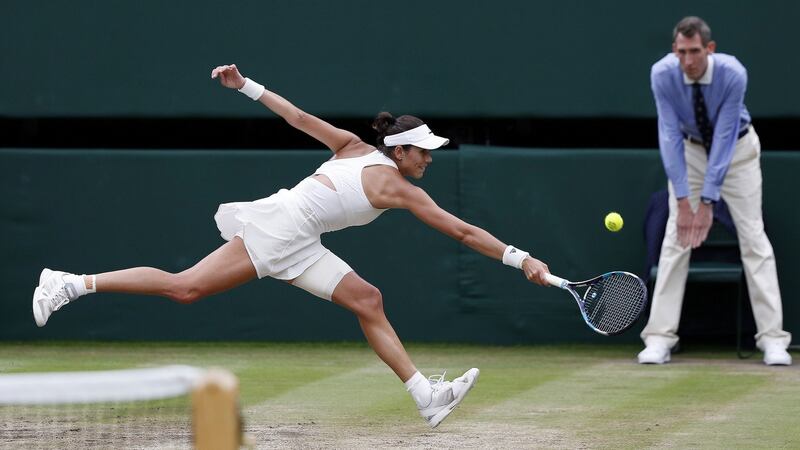 Muguruza returns against Williams. Photo: Adrian dennis/Reuters