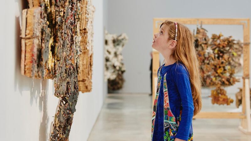 Ruby Rose looking at Black Web Plywood, resin, acrylic, glue, Perspex, screws, 2010