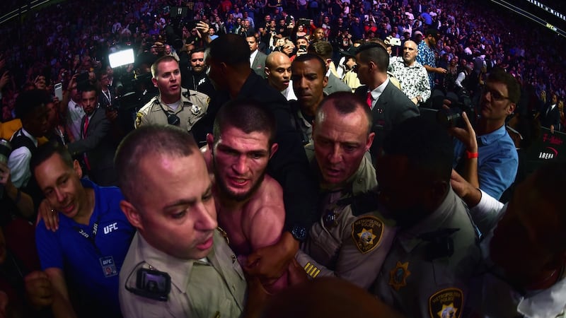 Khabib Nurmagomedov is escorted out of the arena after his win over Conor McGregor. Photograph: Harry How/Getty