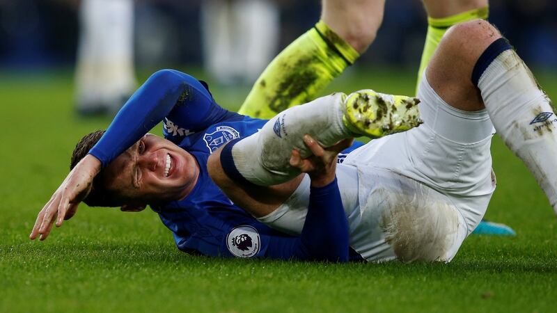 James McCarthy was stretchered off in the second half after suffering a broken leg. Photograph: Andrew Yates/Reuters