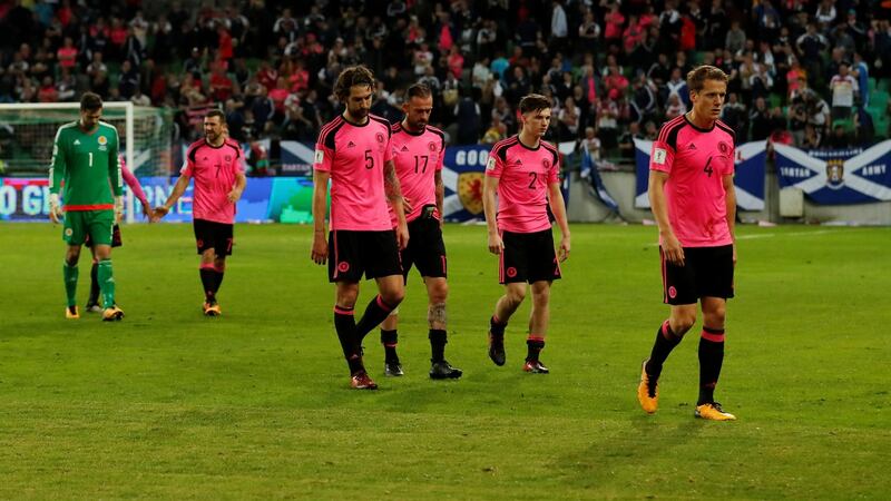 The Scottish players leave the pitch. Photograph: Andrew Boyers/Reuters