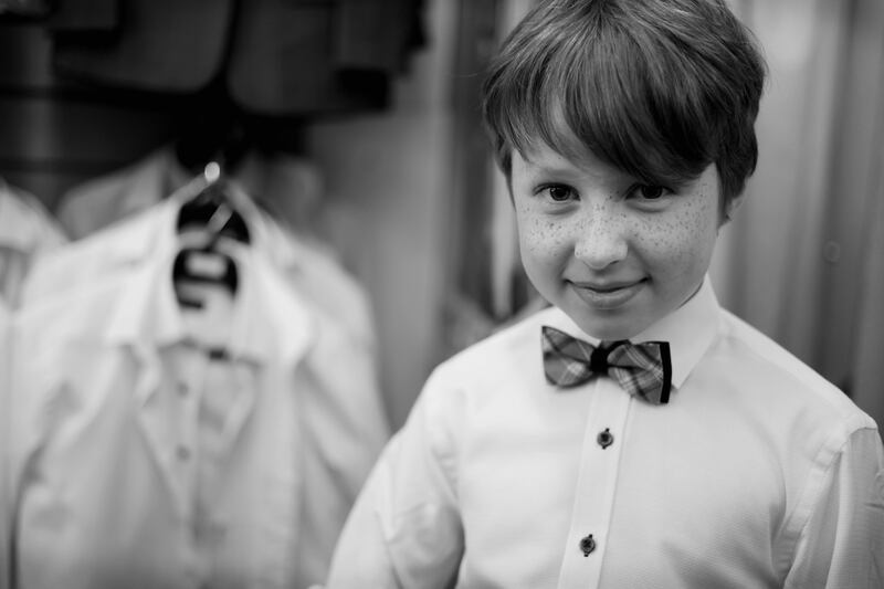 Adam Curran (8) tries on his new suit at Jas Fagan's on Thomas Street, Dublin. Photograph: Bryan O’Brien