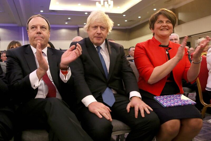 Foster and Nigel Dodds of the DUP with Boris Johnson at the party’s annual conference in Belfast, 2018. Photograph: Paul Faith/AFP/Getty