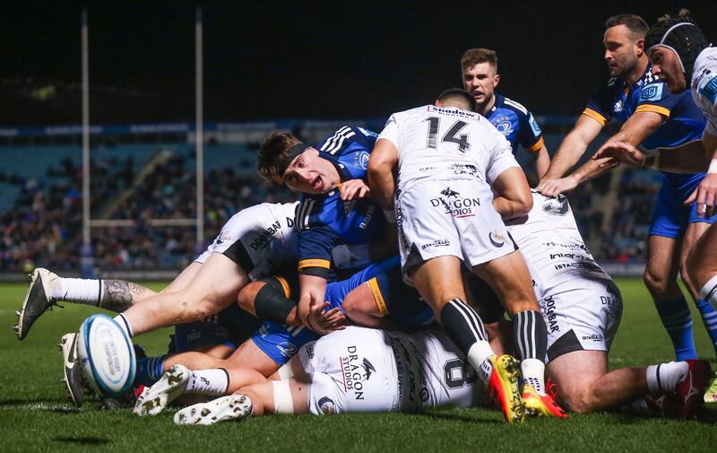 Leinster's Brian Deeny is challenged by Sio Tomkinson of Dragons. Photograph: Tom Maher/Inpho