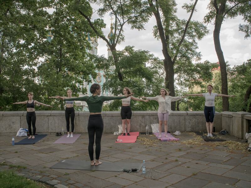Trying to get on with daily life: Women take part in an outdoor barre class at Volodymyr Hill Park in Kyiv, Ukraine, on Wednesday this week. Photograph: Laura Boushnak/New York Times