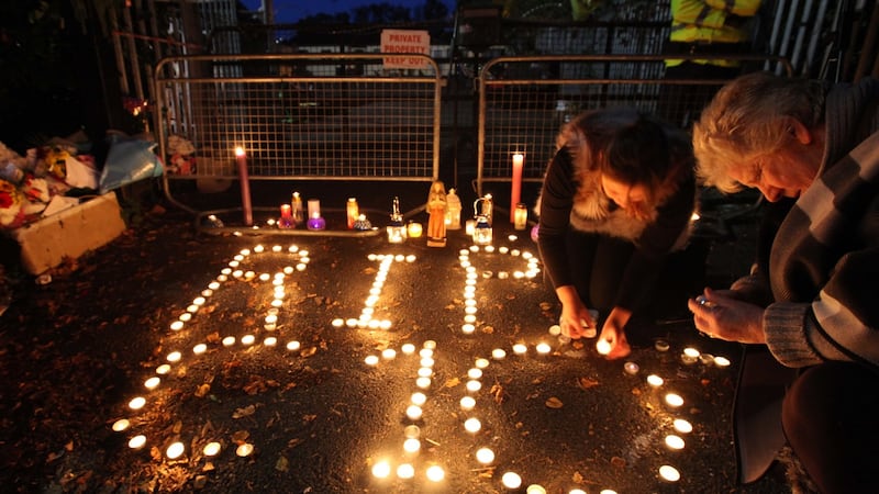 People attend a candlelight vigil for the 10 people who lost their lives Glenamuck halting site fire in Carrickmines,Dublin. Photograph: Stephen Collins/Collins