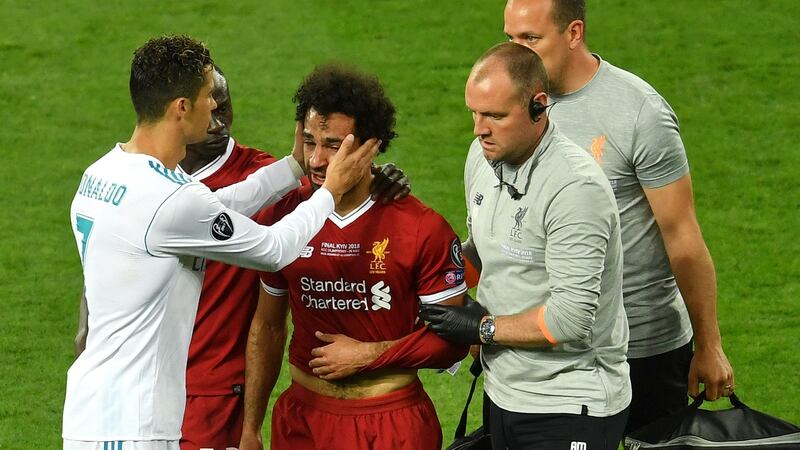 Real Madrid’s  Cristiano Ronaldo  consoles Mohamed Salah of Liverpool as he leaves the pitch injured during the 2018  Champions League final in Kyiv.  Photograph: Mike Hewitt/Getty Images