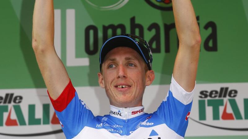 Ireland’s Dan Martin of the Garmin team celebrates on the podium after winning the 108th edition of the Giro di Lombardia (Tour of Lombardy).  Photograph:  Luk Benies/AFP/Getty Images