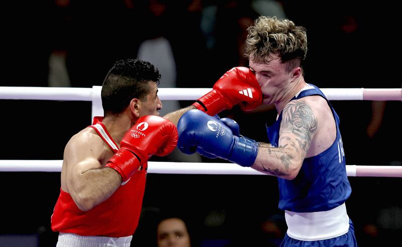 Ireland’s Dean Clancy (blue) under fire from Obada Al Kasbeh of Jordan. Photograph: Ryan Byrne/Inpho