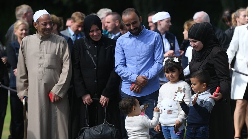 The Hassoun family  including  Saif Eddin Hassoun, Sana Edris, Mohmoud Al A’Araj, Hasba Hassoun, Lana Al A’Araj (6), Aala Al A’Araj, (4) and Tala Al A’Araj (1), wait to meet Pope Francis following a tree planting ceremony at Áras an Uachtaráin. Photograph: Joe Giddens/PA