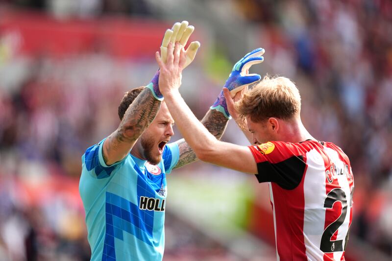 Nathan Collins celebrates victory after the final whistle with Brentford goalkeeper Mark Flekken. Photograph: John Walton/PA Wire