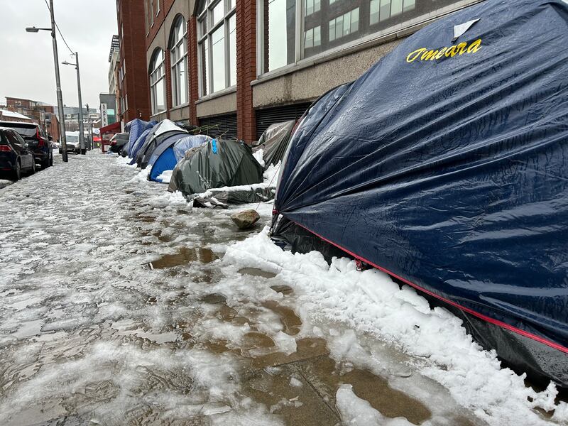Tents, some flooded and collapsed from snow, used by migrants and other people experiencing homeless outside the International Protection Office during in Dublin on Friday. Photograph: Cillian Sherlock/PA Wire