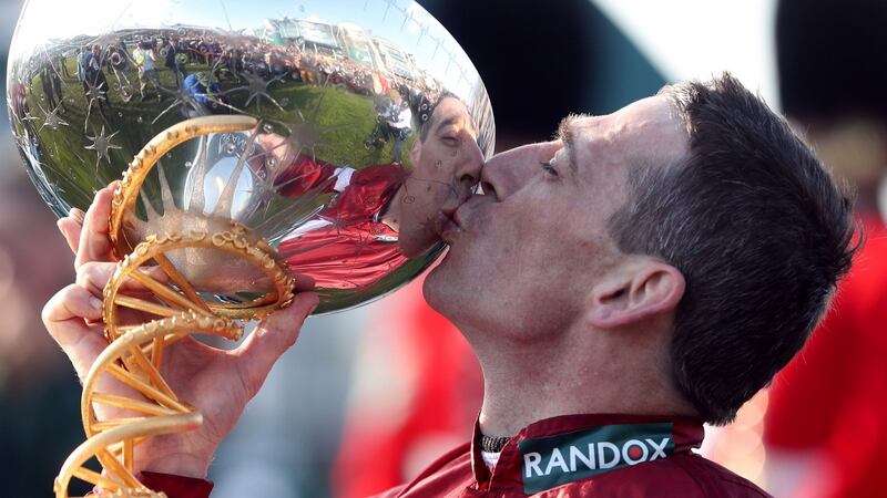 Russell kisses the trophy after winning the Randox Health Grand National Handicap Chase with Tiger Roll. Photo: David Davies/PA Wire