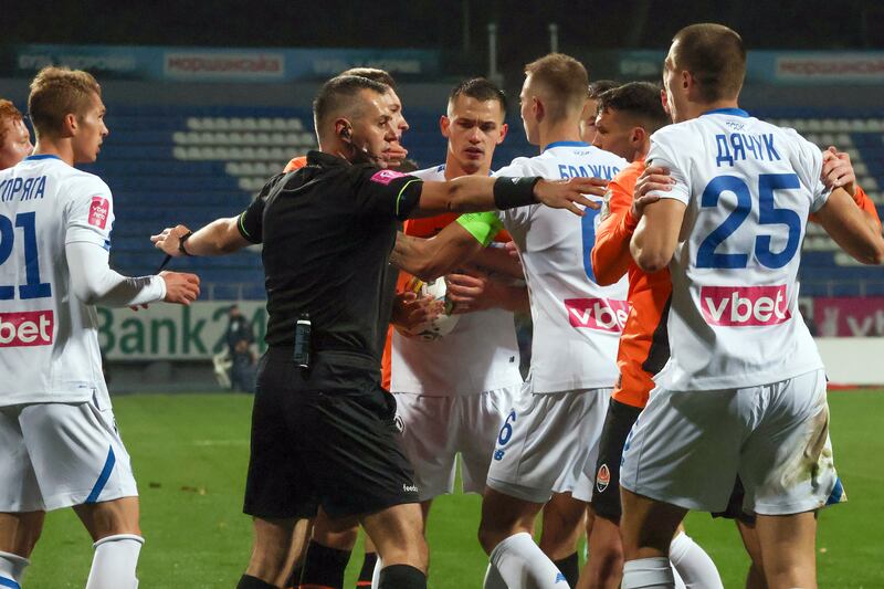 A referee tries to stop an argument between the players of Dynamo Kyiv and Shakhtar Donetsk during this month's Ukrainian Premier League fixture. Photograph: Ukrinform/NurPhoto via Getty Images